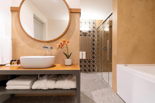 a bathroom with a sink and a mirror at Palazzo Gulino in Palma di Montechiaro