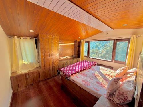 a bedroom with a large bed in a house at Pinewood View Homestay in Shimla