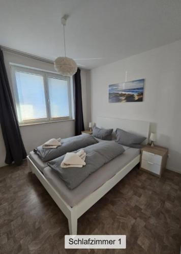 a bedroom with a bed in a room at Ferienwohnung ANKER in Lubmin