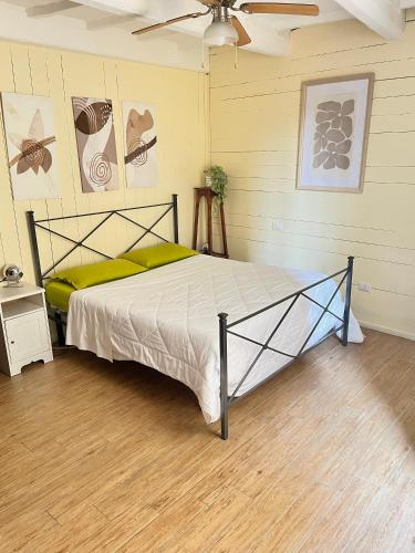 a bedroom with a bed in a room at La Casa di Alice in Perugia