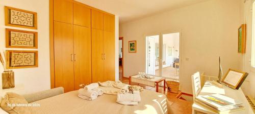 a living room with a bed and a table at Villa Erika by Solidays in Moraira