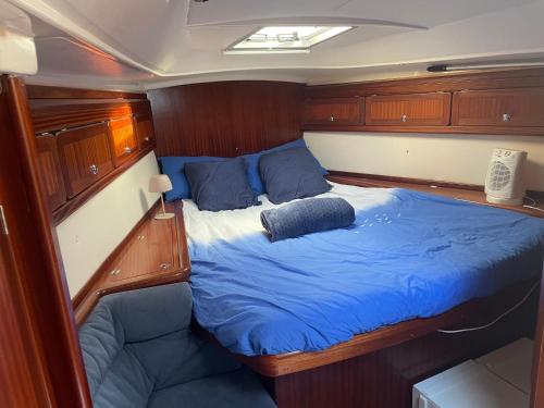 a bed in the back of a boat at Entire boat 3 cabins in Birgu vittoriosa in Birgu