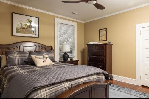 a bedroom with a bed and a ceiling fan at 5BR Historic Downtown Edenton in Edenton