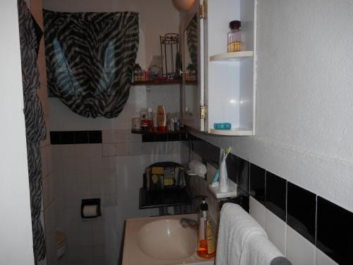 a bathroom with a sink and a mirror at Blue Horizons Guest House in Warwick Camp
