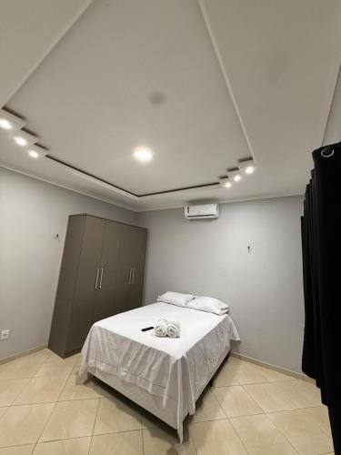a bedroom with a white bed in a room at Casa Bragança in Bragança
