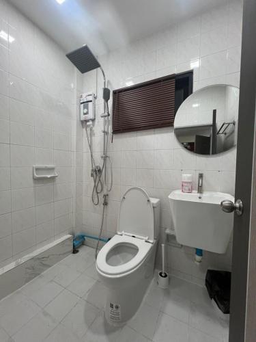a bathroom with a shower and a toilet and a sink at Brand new furnished studio Apartment near old Town in Phuket