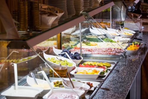 a buffet line with many plates of food at Hotel Himmelreich in Mariazell
