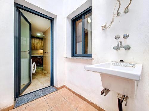 a bathroom with a white sink and a shower at San Pedro Centro - 9110 in San Pedro del Pinatar