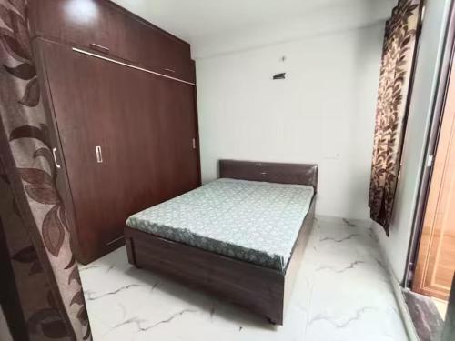 a small bedroom with a bed in a room at 3bhk Villa WIth Terrace in Alwar