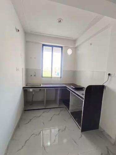 an empty room with a desk and a window at 3bhk Villa WIth Terrace in Alwar