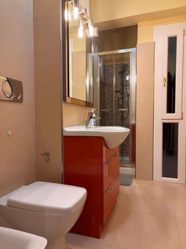 a bathroom with a toilet and a sink at Bed and Breakfast San Valentino in Terni