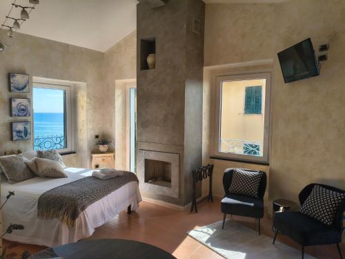 a bedroom with a bed and a fireplace at Alla Porta Rossa in Manarola