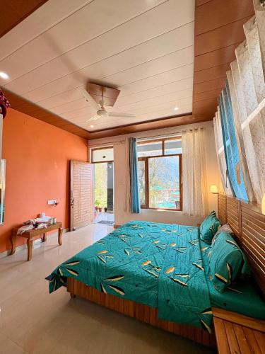 a bedroom with a large green bed in a room at Brekora X RajStays in McLeod Ganj