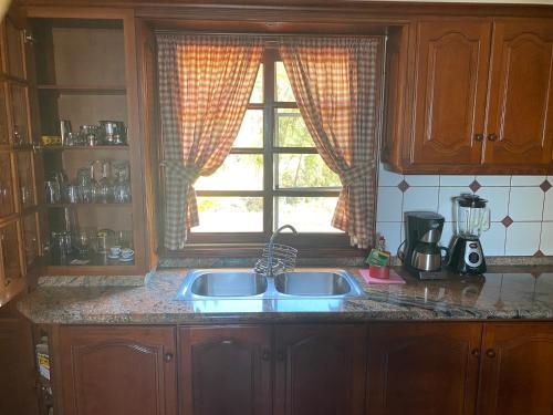 a kitchen with a sink and a window at Taburiente in Tijarafe