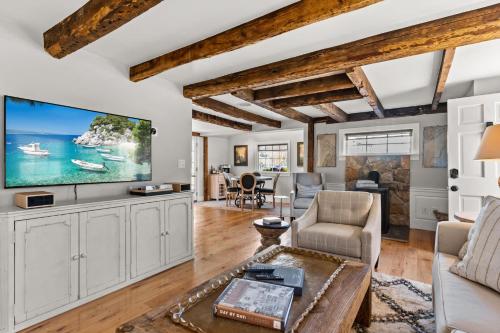 a living room with a large flat screen tv at Circa 1789 Historic South End Downtown Home in Newburyport