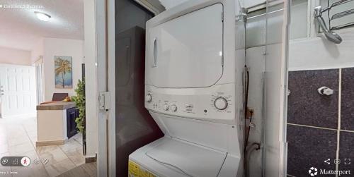 a white washer and dryer in a kitchen at Best area and ocean view in Cruz de Huanacaxtle
