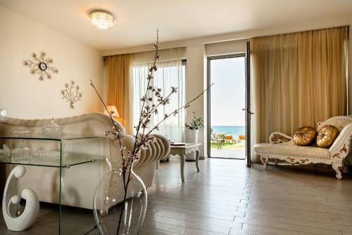 a living room with a view of the ocean at Sea View Beachfront Villa Maria in Gouves