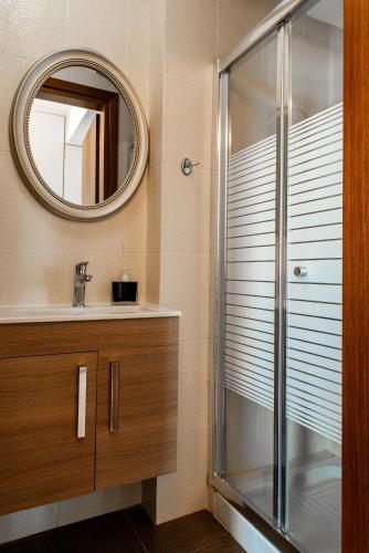 a bathroom with a shower and a sink at Sea View Beachfront Villa Maria in Gouves