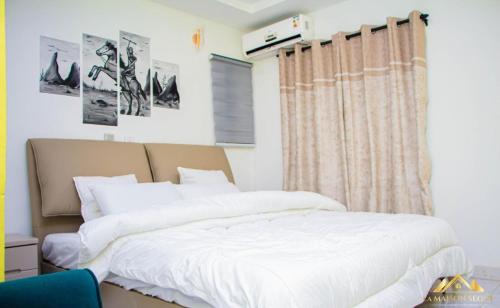 Llit o llits en una habitació de La MAISON SEONE BUSINESS