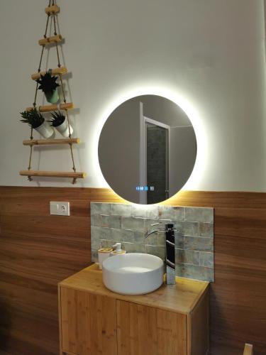 a bathroom with a sink and a mirror at Bellver bedrooms in Xàtiva