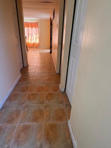 a hallway with a tile floor in a house at Alojamiento casa en Toconao, chile in Toconao