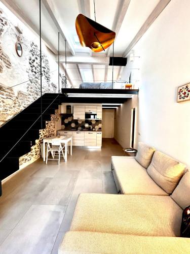 a living room with a couch and a table at Perla Loft in Seriate
