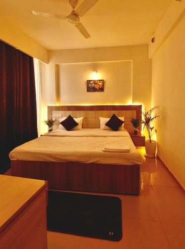 a bedroom with a large bed in a room at Peaceful Stay at Vrindavan in Vrindāvan