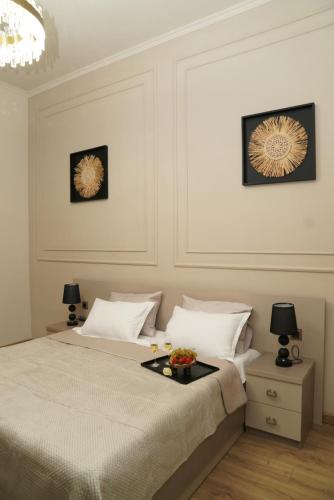 a bedroom with a bed with a tray on it at EL hotel in Kutaisi