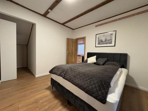 a bedroom with a large bed in a room at Apartman Bor in Kiseljak