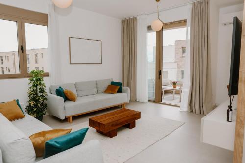 a living room with a couch and a table at Bella Vista Residence with private Free Parking in Baošići
