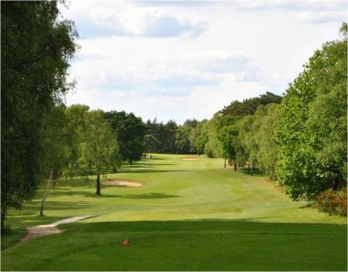 a view of a golf course with a green at Smugglers Retreat in Hunstanton