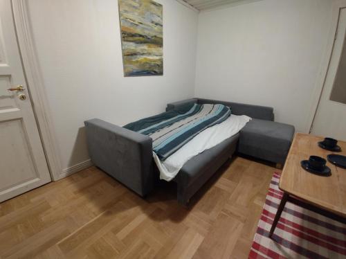 a bed sitting in a corner of a room at Älgklinten with type 2 charger in Brograngen