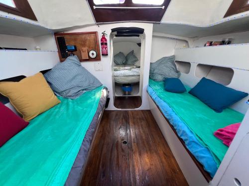 two beds in the back of an rv at Voilier Bateau Rochefort in Rochefort