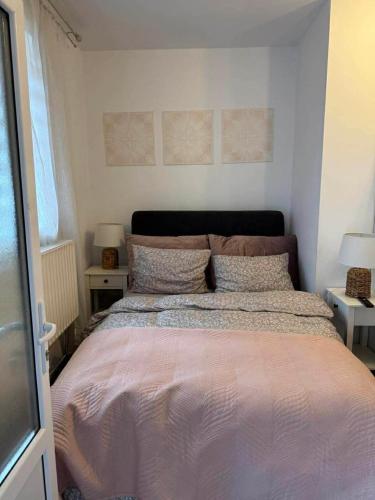 a bedroom with a large bed with two night stands at Casa Elena, Ocna Mureș in Ocna-Mureşului
