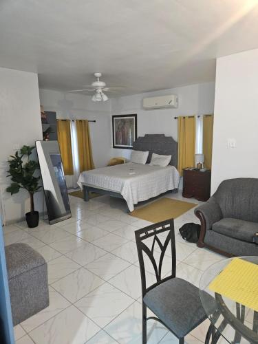 a large living room with a bed and a couch at Holiday festivity in St Mary