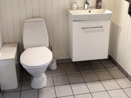 a bathroom with a white toilet and a sink at 4 person holiday home in Læsø-By Traum in Læsø