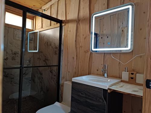 a bathroom with a sink and a shower at Calcopirita Stay House in Rivas