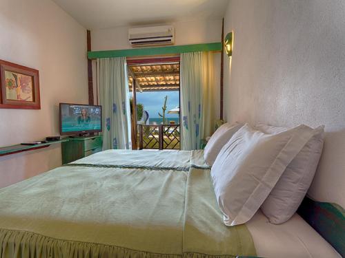 Postel nebo postele na pokoji v ubytování Bruno Marambaia Charme Hotel