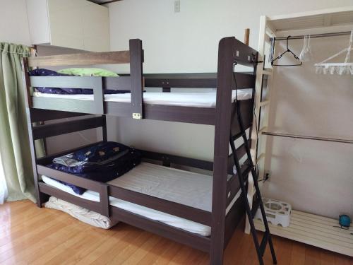 a group of bunk beds in a room at Kōnotori no sato no yado - Vacation STAY 11111 in Kōnosu