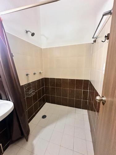 a bathroom with a shower and a sink at Casa Brisas in Puerto Escondido