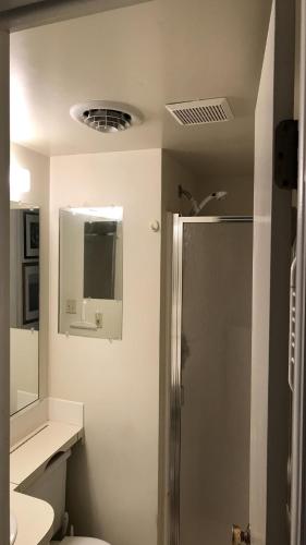 a bathroom with a shower and a toilet and a sink at Parsons Folly Unit 3 in Cape May Point