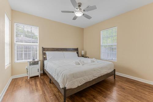 a bedroom with a bed and a ceiling fan at 5 beds 2 bath, sleep 10 in Corpus Christi