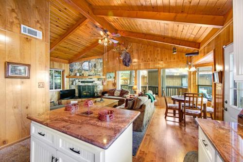 a kitchen and living room of a cabin at Lakeside Serenity in Crestline