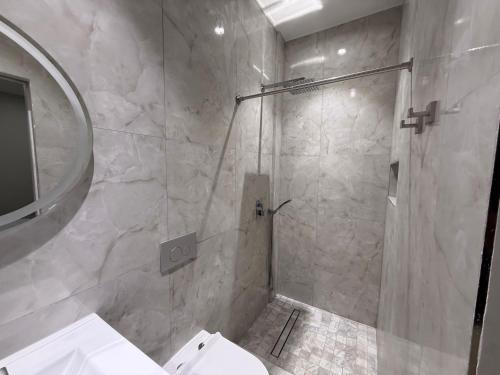 a bathroom with a shower with a toilet and a sink at Sanrai in Gros Islet