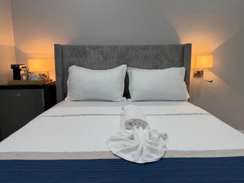 a bedroom with a bed with a towel on it at Sanrai in Gros Islet