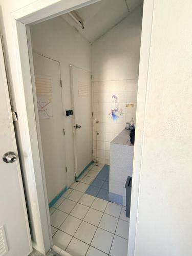 a bathroom with a sink and a counter in a room at Hostel Cafe13 in Ko Phangan