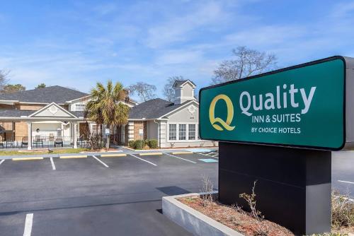 a sign in a parking lot in front of a house at Quality Inn & Suites Lexington in Lexington
