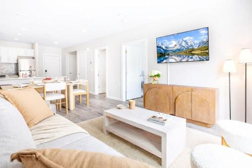 a living room with a couch and a table at DTWN Yale Wooster Square Laundry in New Haven