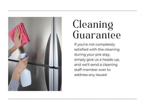 a woman is cleaning a refrigerator with a towel at DTWN Yale Wooster Square Laundry in New Haven