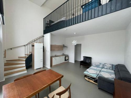 a living room with a bed and a table at moderne Loft in Vienna